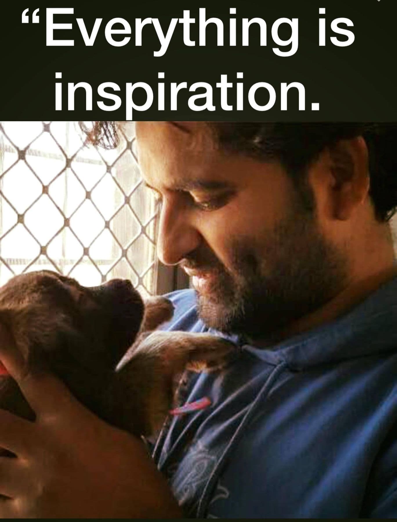 Dr. D.P. Shukla holding a puppy, captioned “Everything is inspiration.”