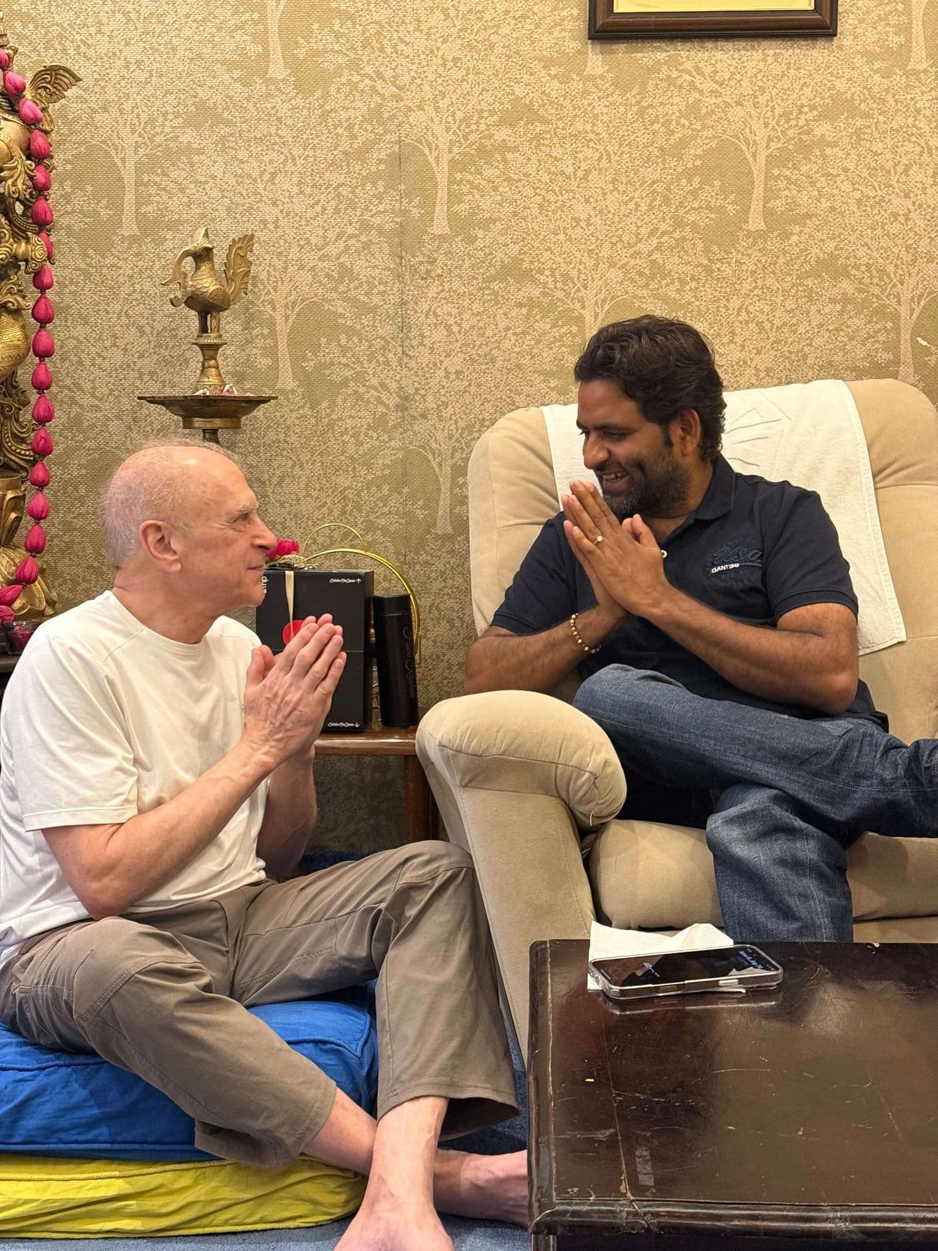 Dr. D.P. Shukla and a visitor with folded hands in the consultation room