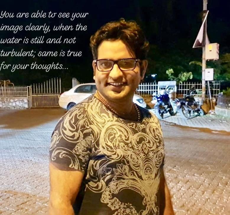 Quote card with Dr. D.P. Shukla at night: “You are able to see your image clearly, when the water is still and not turbulent; same is true for your thoughts.”