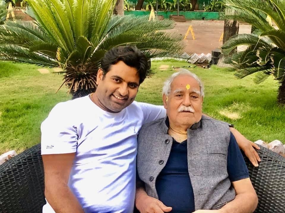 Dr. D.P. Shukla with an elderly man in a garden