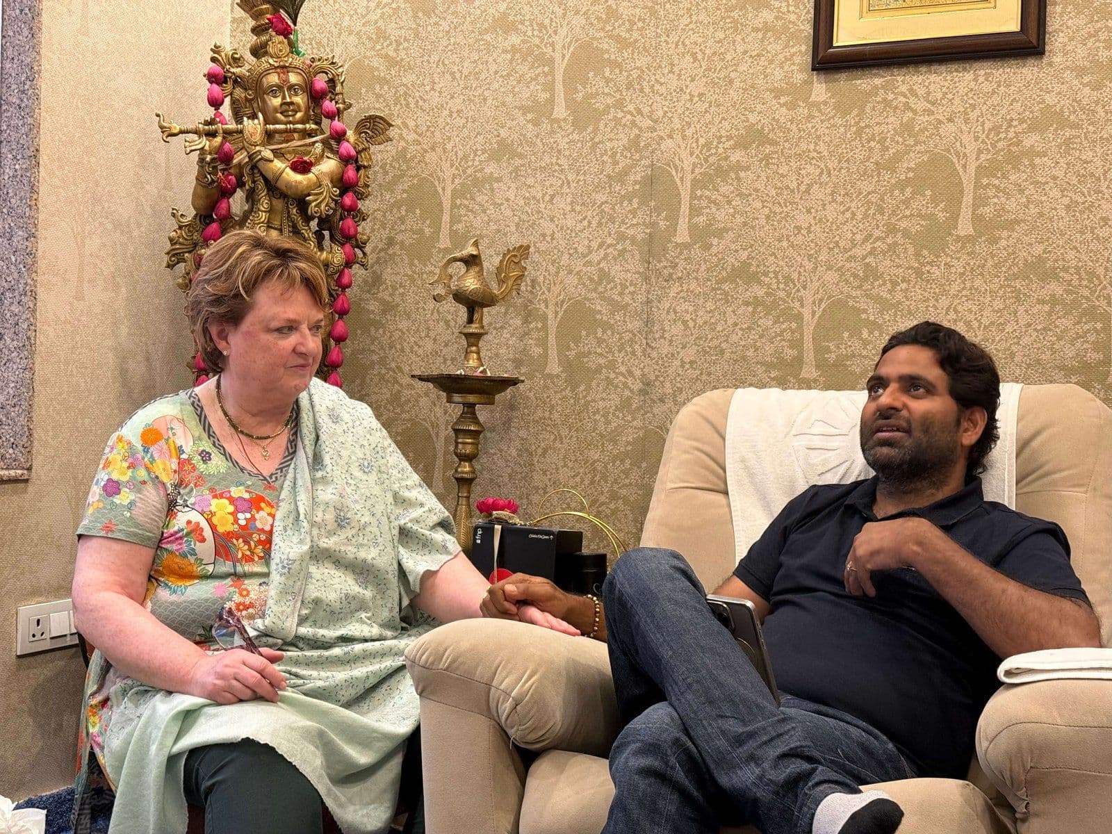 Dr. D.P. Shukla listening to a visitor in the consultation room