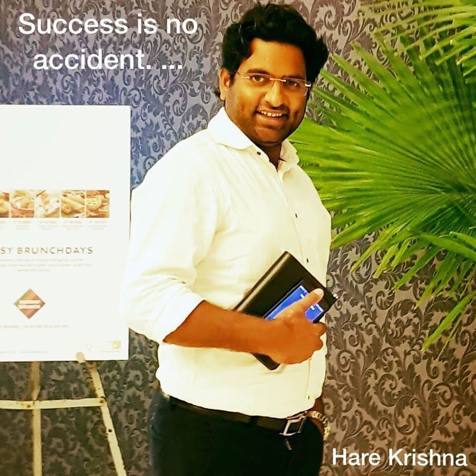 Quote card with Dr. D.P. Shukla holding a diary: “Success is no accident.”