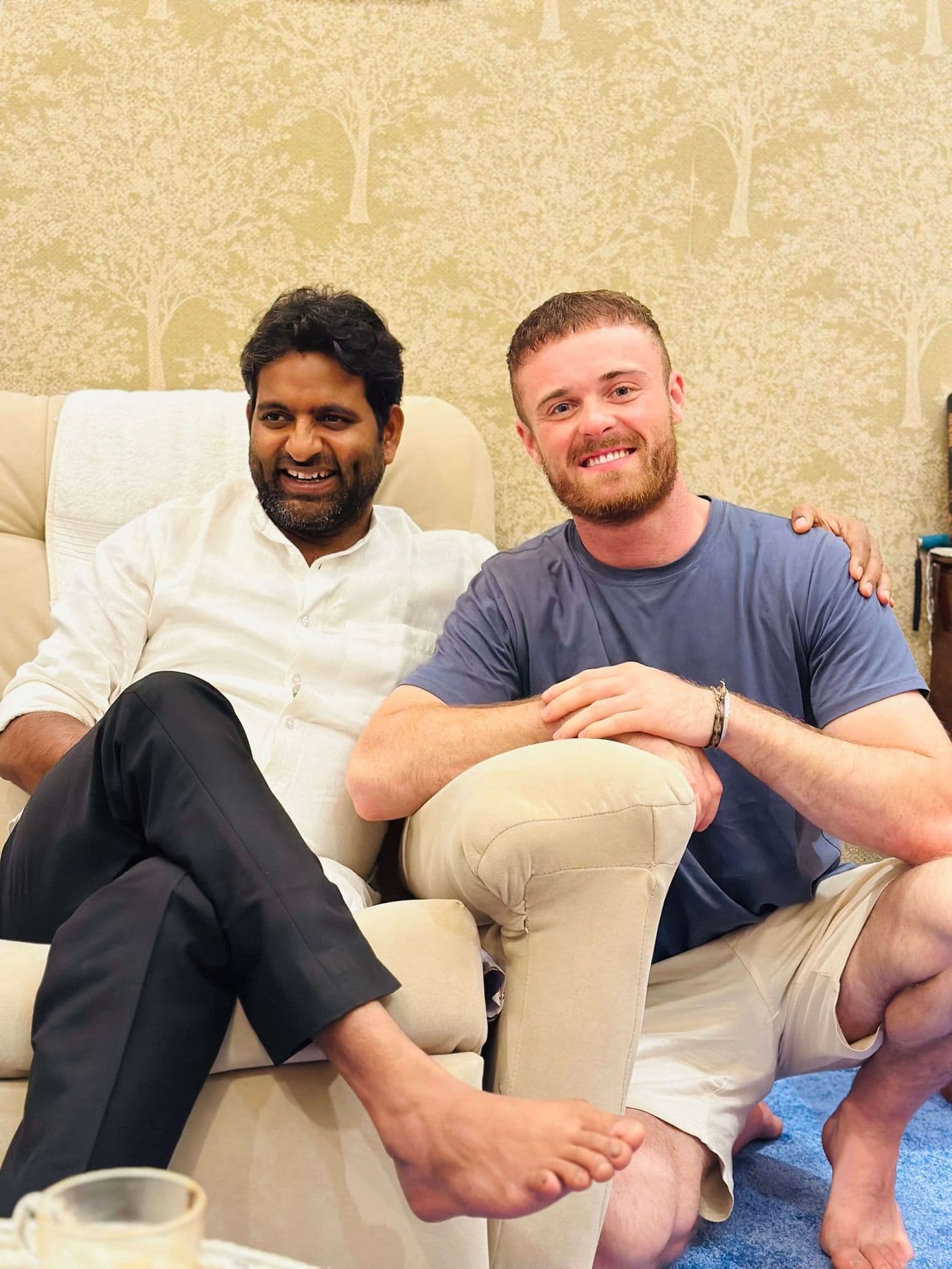 Dr. D.P. Shukla and a young man seated together in the consultation room