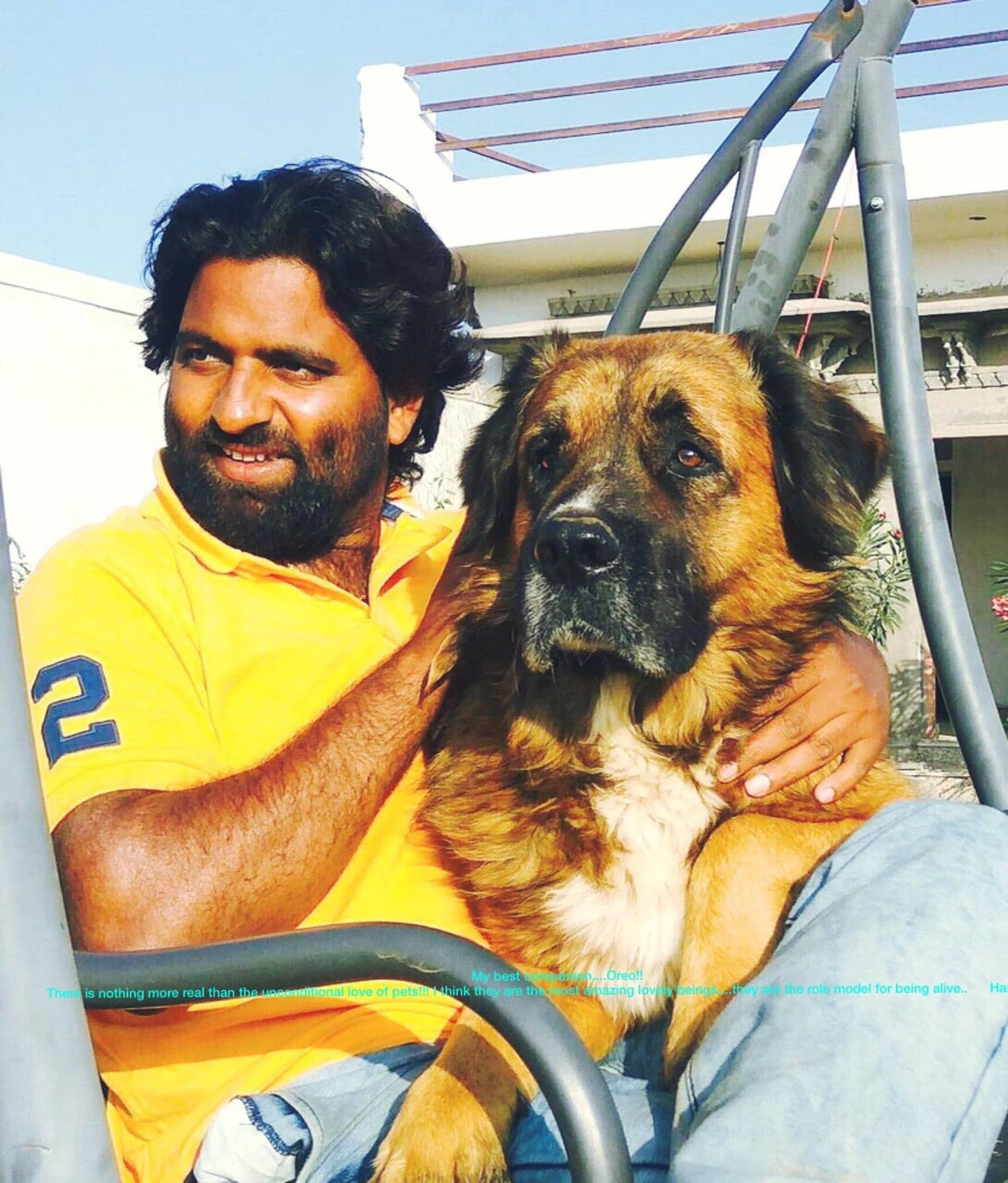 Dr. D.P. Shukla hugging a large dog