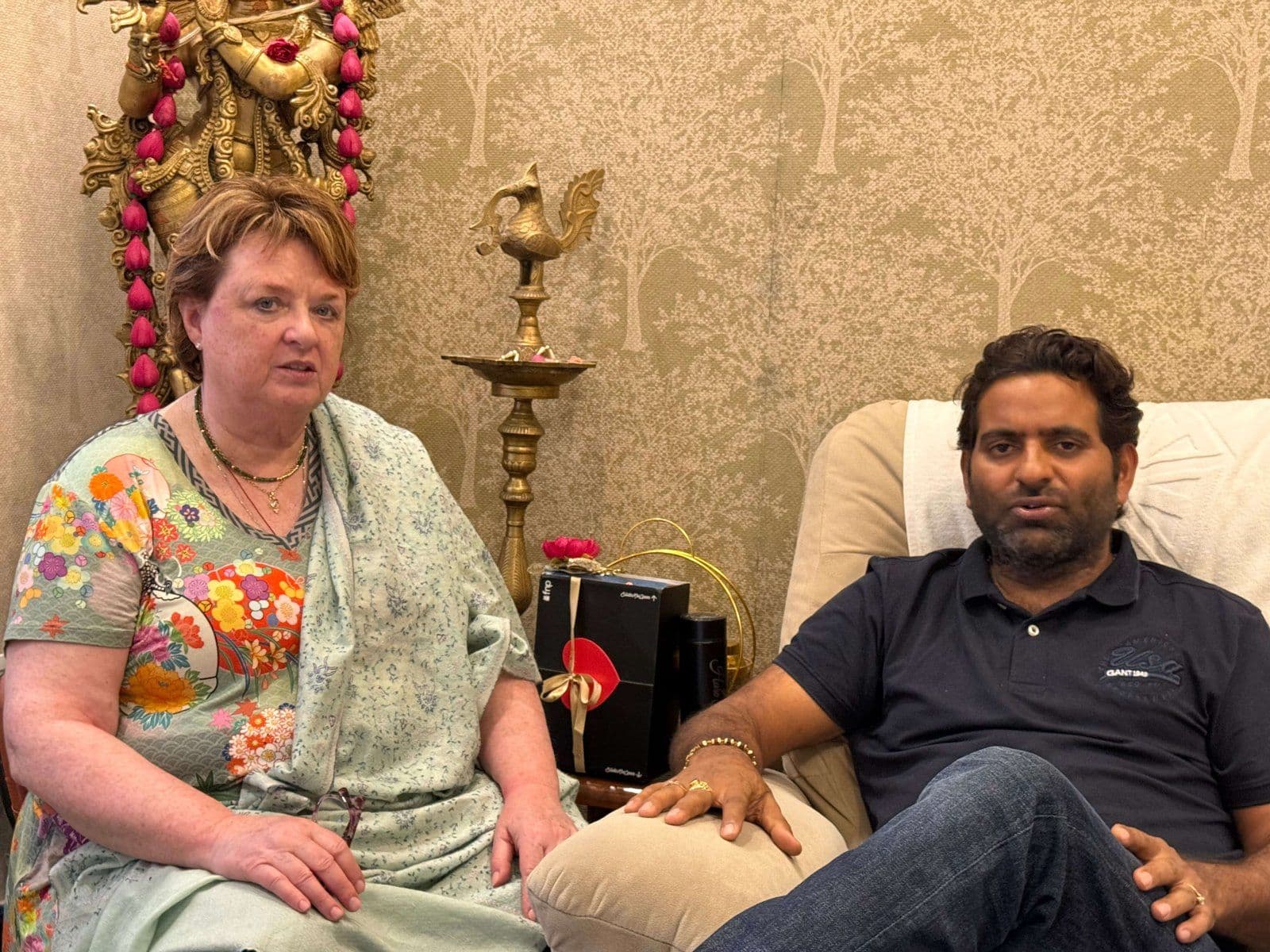 Dr. D.P. Shukla in conversation with a visitor in the consultation room