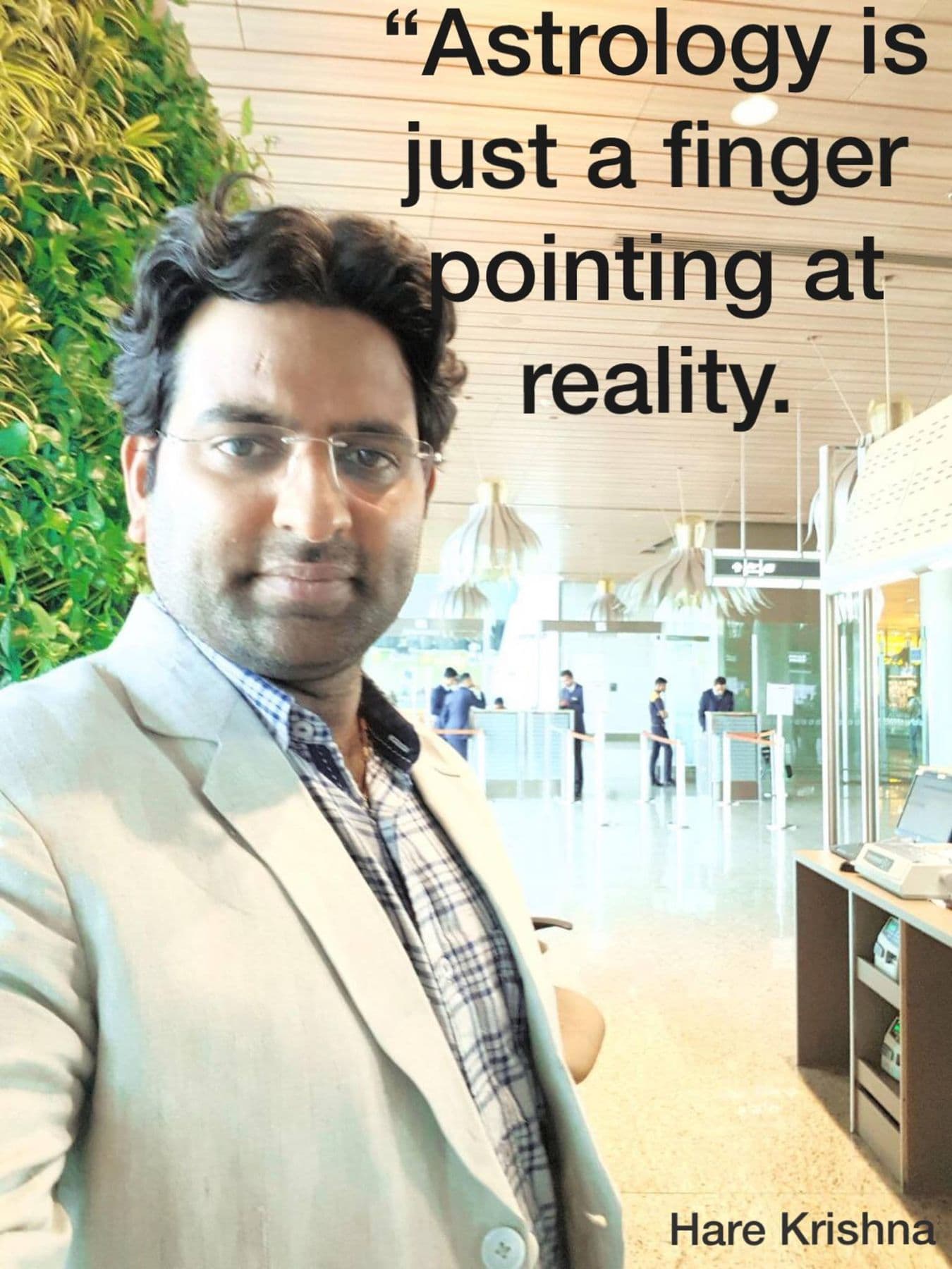 Quote card with Dr. D.P. Shukla at an airport: “Astrology is just a finger pointing at reality.”