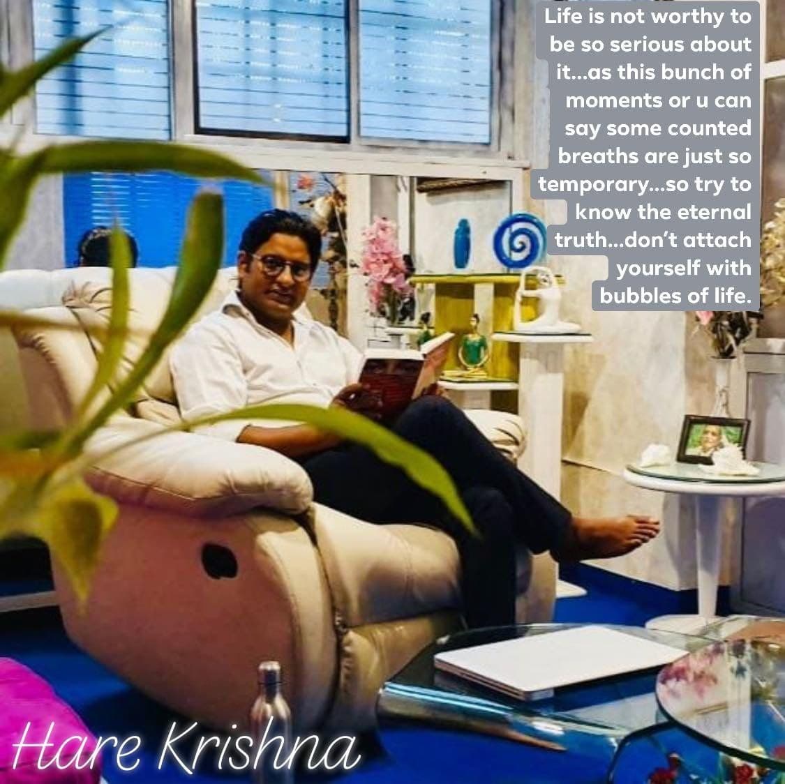 Dr. D.P. Shukla reading in an armchair, captioned “Life is not worthy to be so serious about it… Hare Krishna”