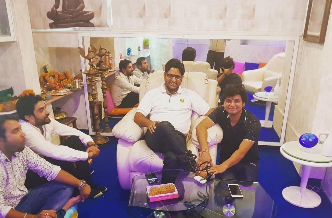 Dr. D.P. Shukla with guests seated in a lounge