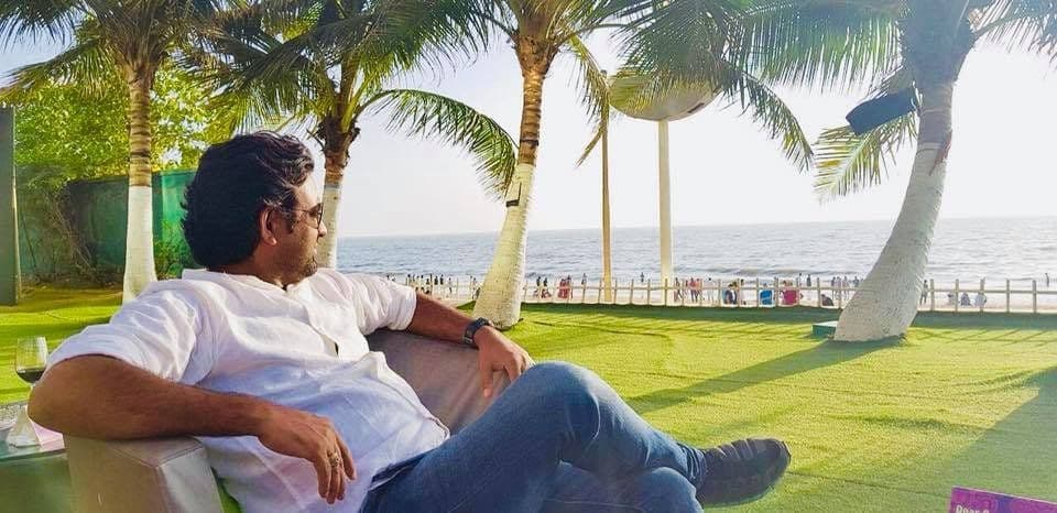 Dr. D.P. Shukla relaxing on a seaside lawn