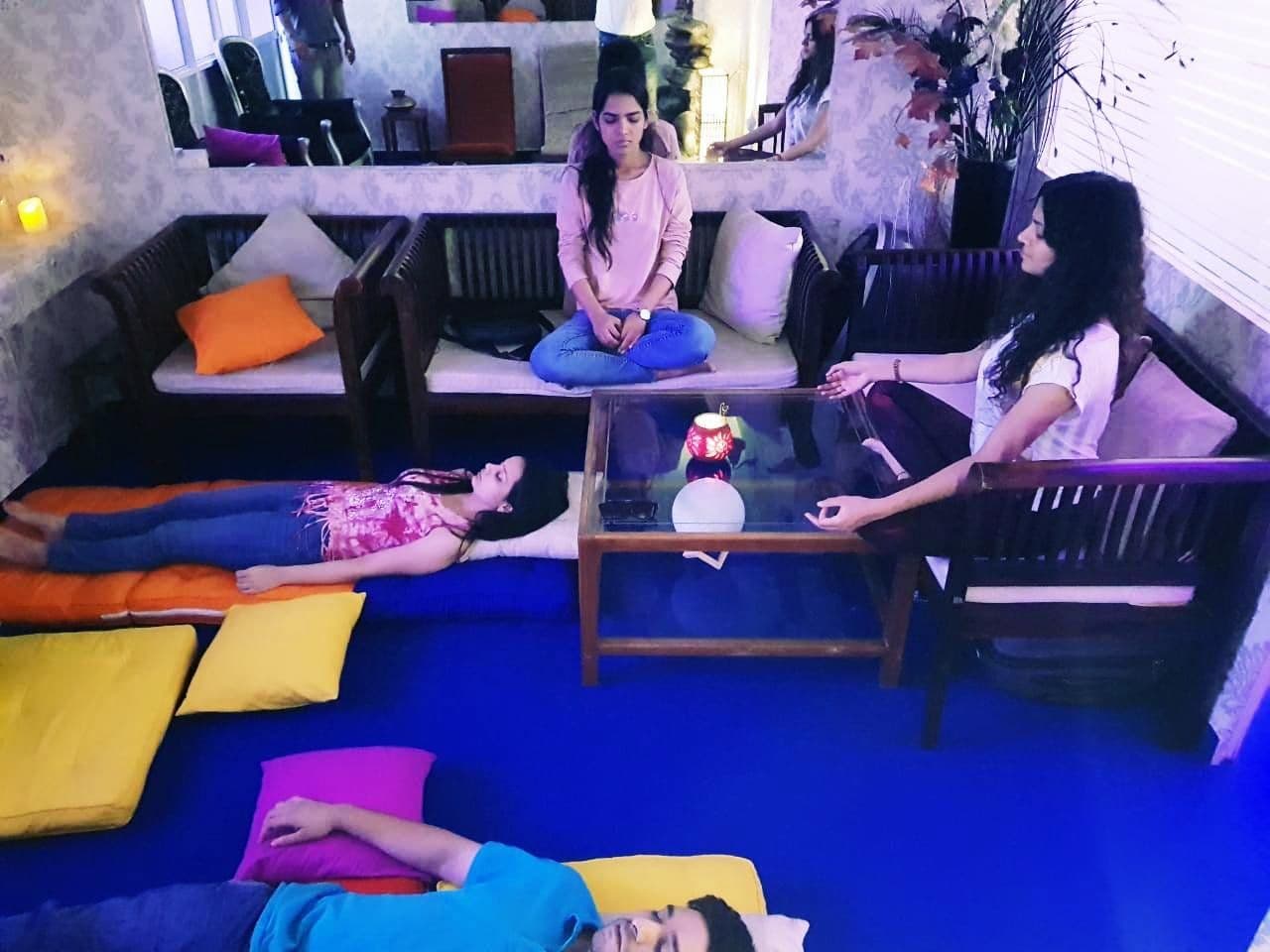 Guests resting on cushions during a guided meditation