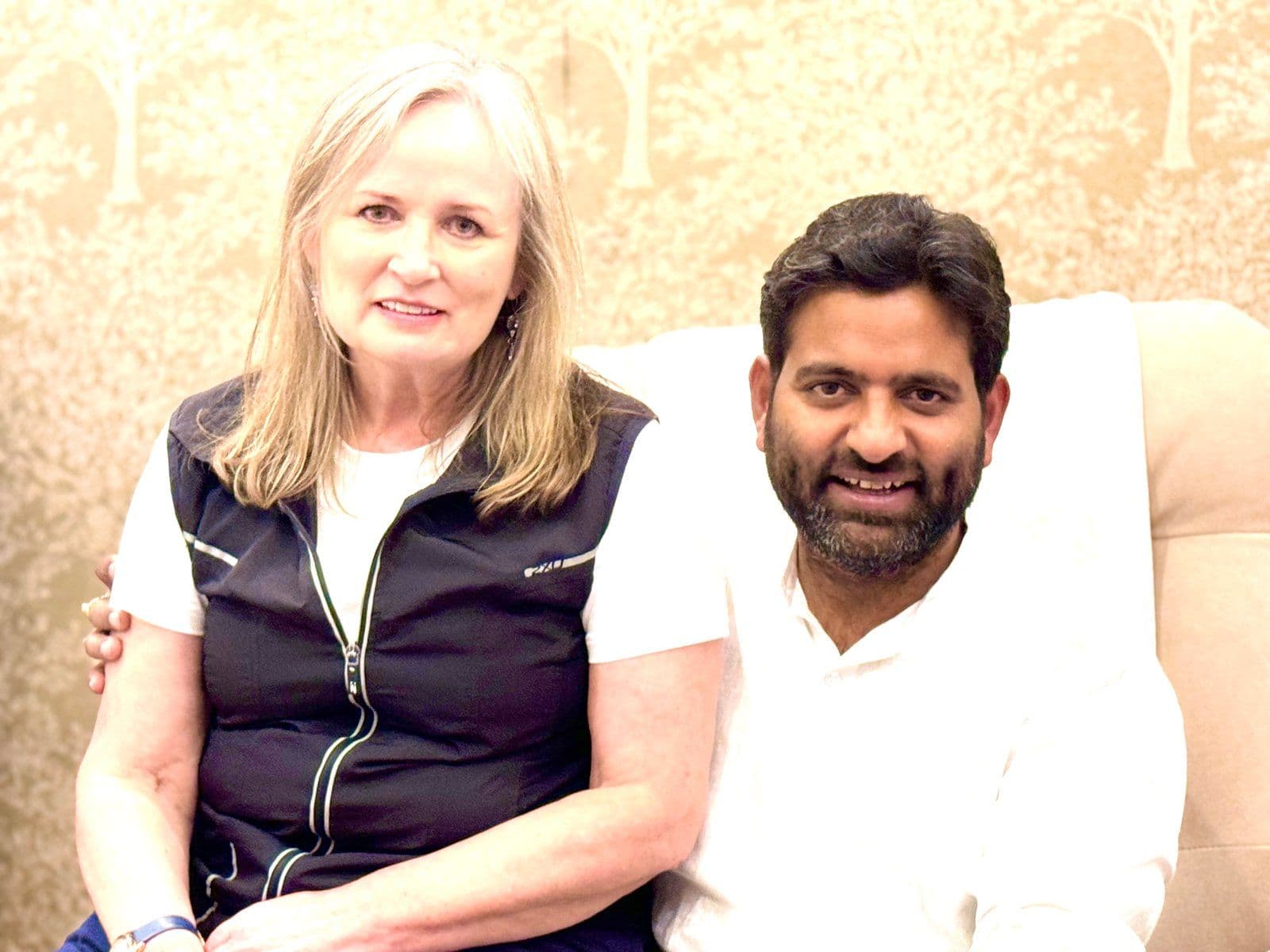 Dr. D.P. Shukla with a visitor, both smiling