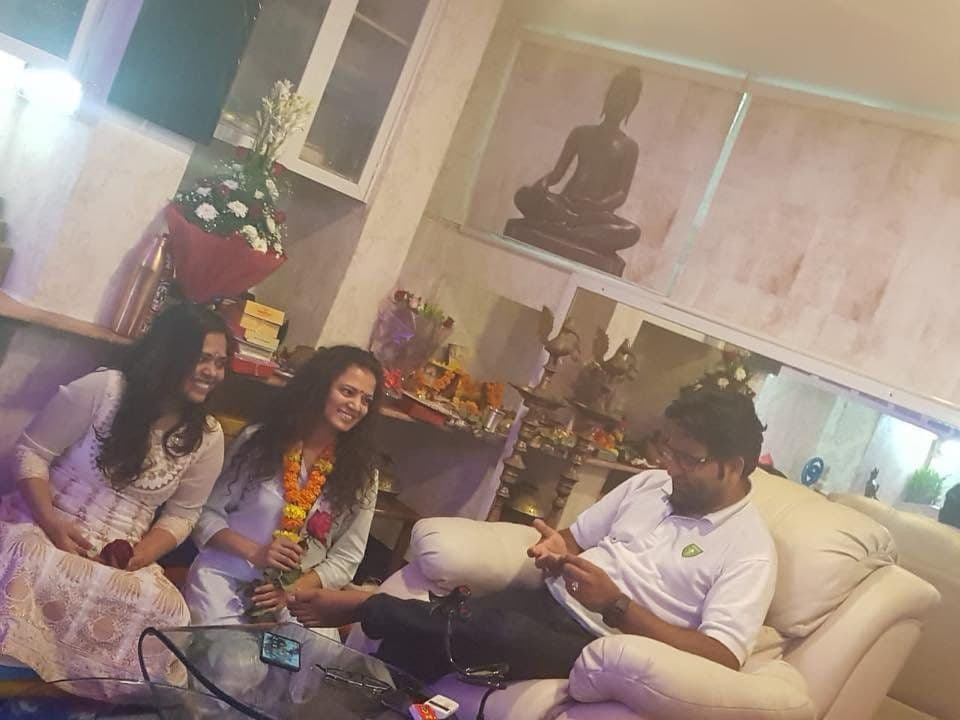 Dr. D.P. Shukla with three guests in the consultation room